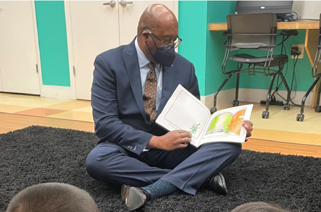 Harvey reading to students