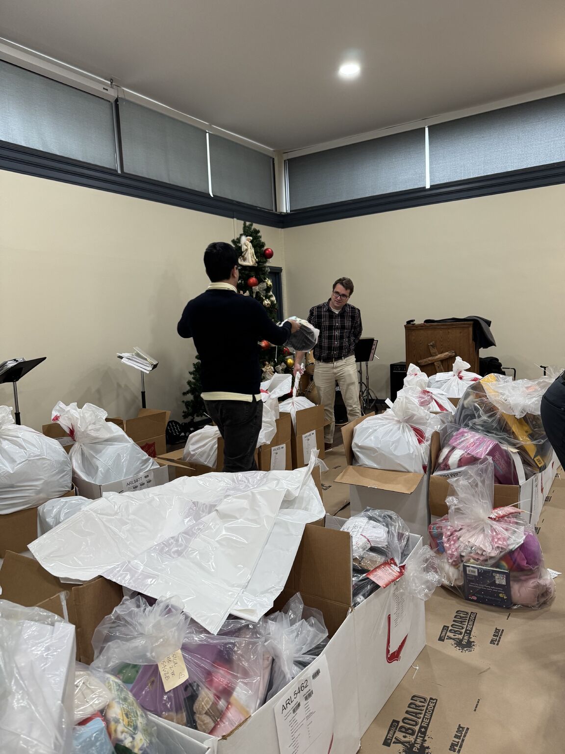 PR-img-12-16-25-salvation-army-2 Packing and organizing gifts at The Salvation Army's Angel Tree program.