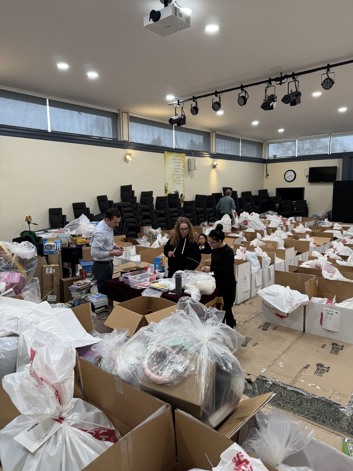 PR-img-12-16-25-salvation-army-3 Packing and organizing gifts at The Salvation Army's Angel Tree program.